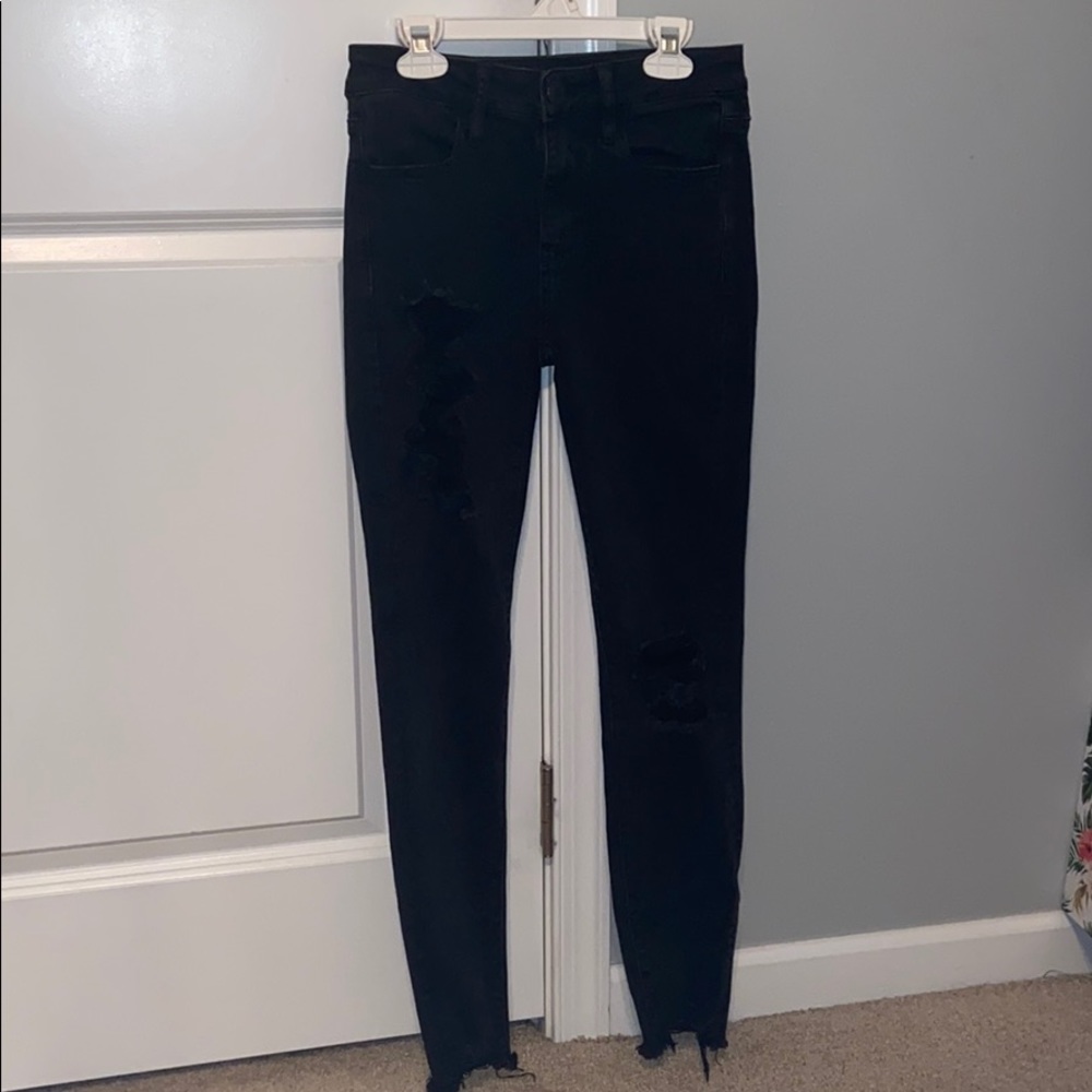 Mid rise black skinny jeans with rips